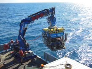 ROV Jason being lowered into the water.